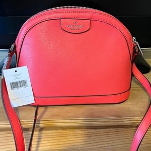 New with tags, never worn Kate Spade XL Dome Crossbody bag Color pink/orange